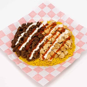 Hyper-realistic Mix Lamb & Chicken Over Rice platter on check deli paper with tender seasoned lamb and juicy chicken served over fluffy yellow rice, drizzled with creamy white sauce and spicy hot sauce. Perfect Halal food or lunch near me in Newport News.
