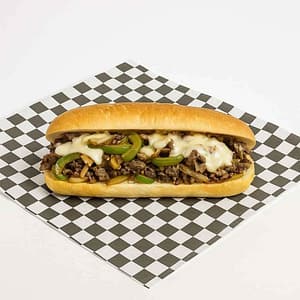 Hyper-realistic Philly Cheesesteak Hero on check deli paper with thinly sliced steak, grilled peppers, onions, and melted mozzarella cheese on a toasted hero roll. Perfect cheesesteak or lunch near me in Newport News.